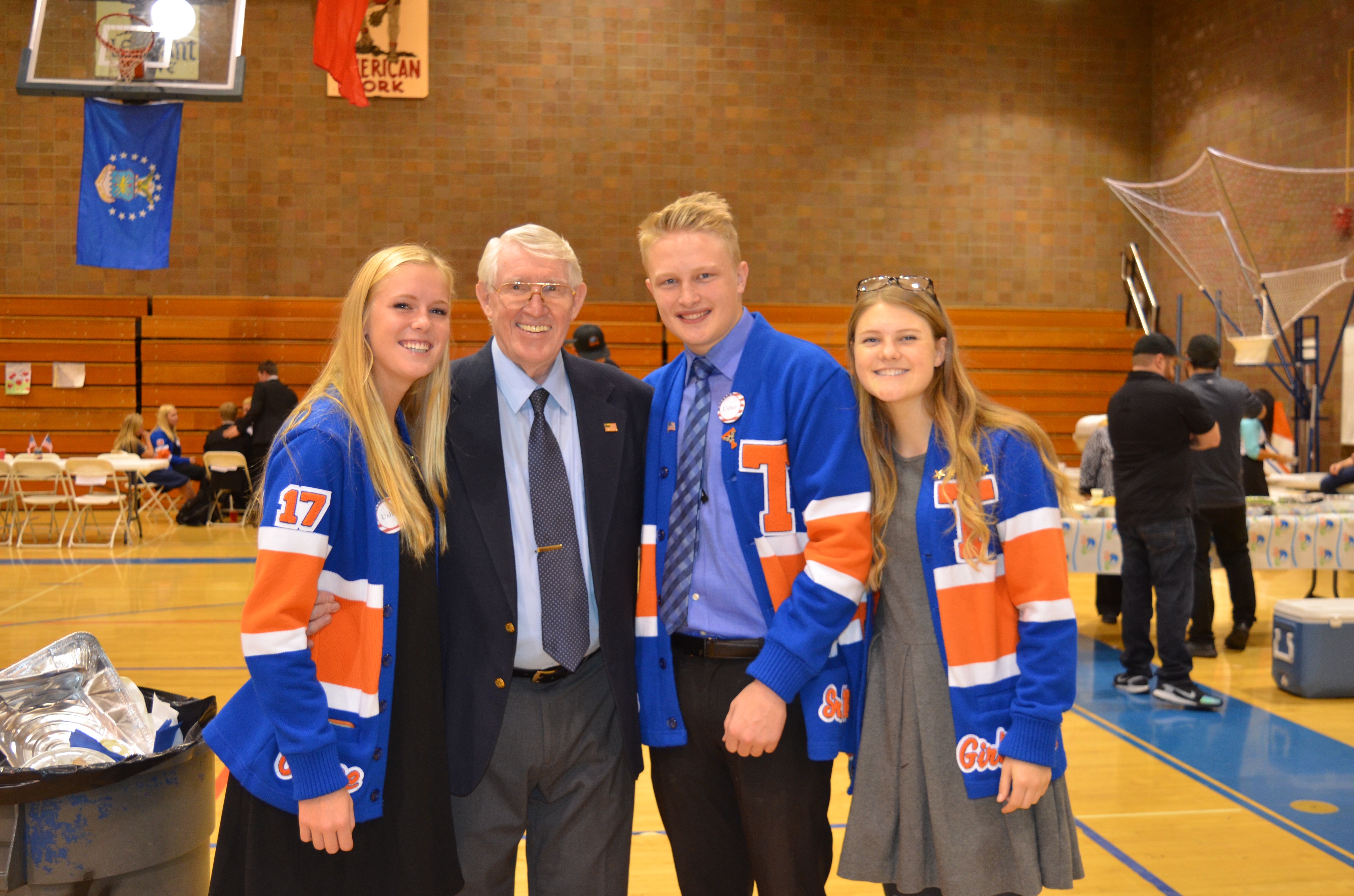 Trevor Shumway with one of Utah's veterans correspondents in Timpview Highschool's Veteran's Day assembly.