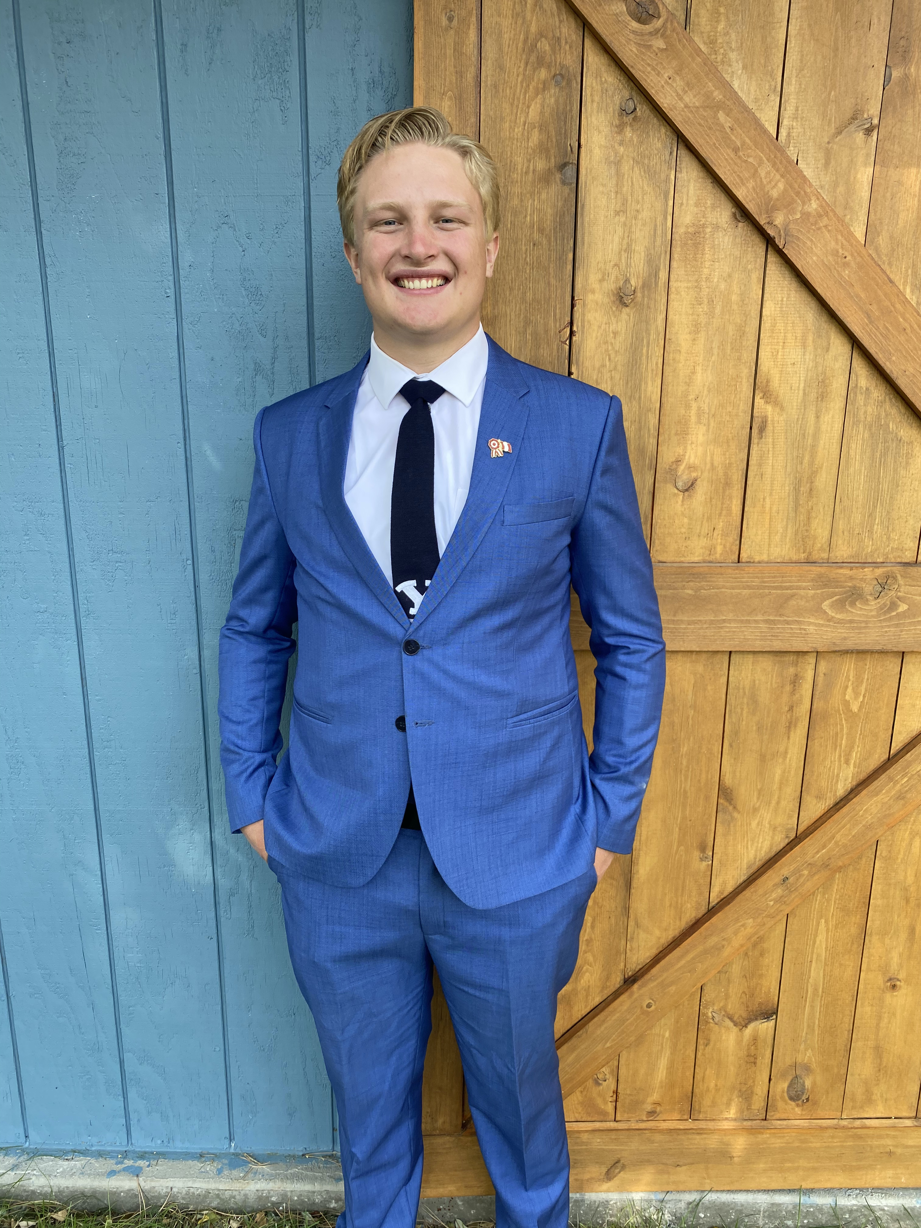 Trevor Shumway in professional attire wearing a BYU tie from Peru